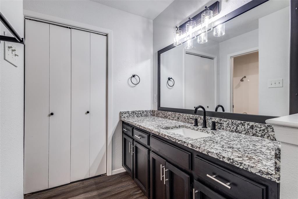 3326 Gardenview Circle Denton, TX 76207 - Photo 8 of 13 a bathroom with a granite countertop sink and a mirror