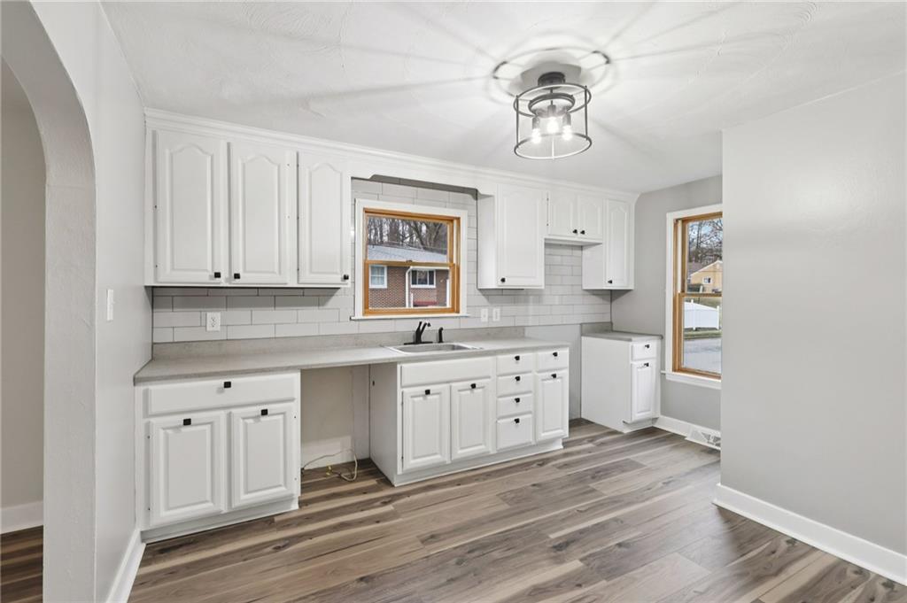 380 James Street Springdale, PA 15144 - Photo 13 of 34 a kitchen with stainless steel appliances granite countertop a white cabinets a sink and dishwasher