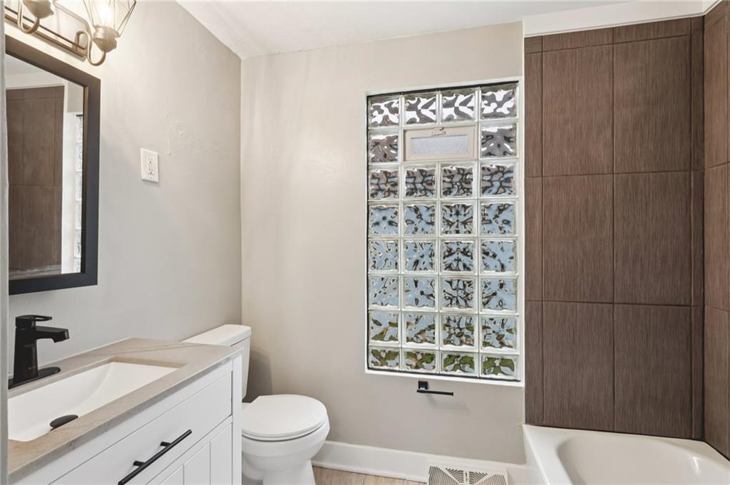 380 James Street Springdale, PA 15144 - Photo 17 of 34 a bathroom with a sink a toilet and shower
