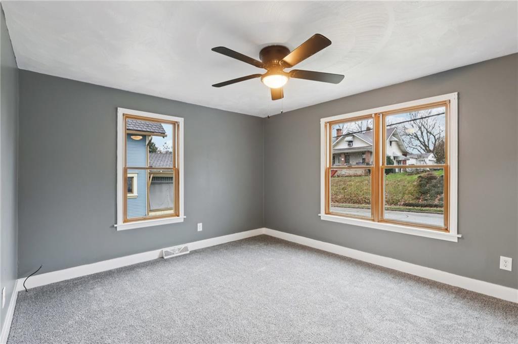 380 James Street Springdale, PA 15144 - Photo 20 of 34 an empty room with windows and fan