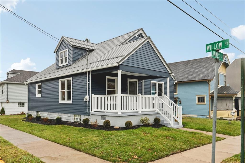 380 James Street Springdale, PA 15144 - Photo 2 of 34 a front view of a house with a yard