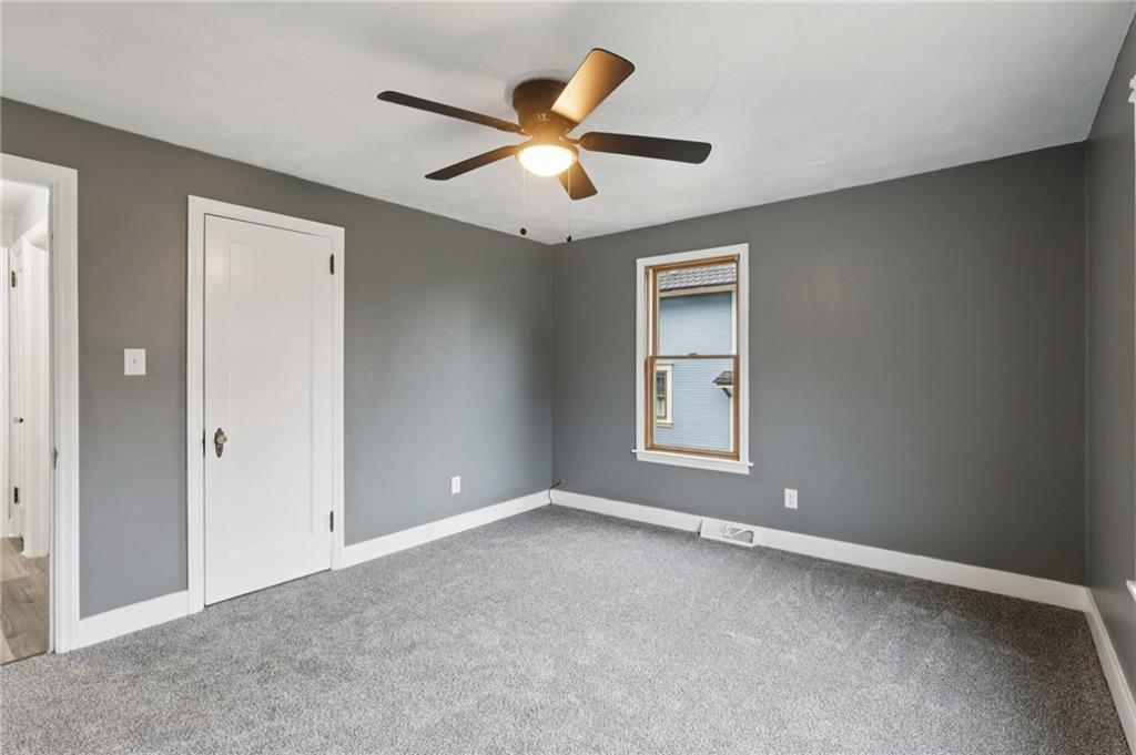 380 James Street Springdale, PA 15144 - Photo 21 of 34 an empty room with ceiling fan and window