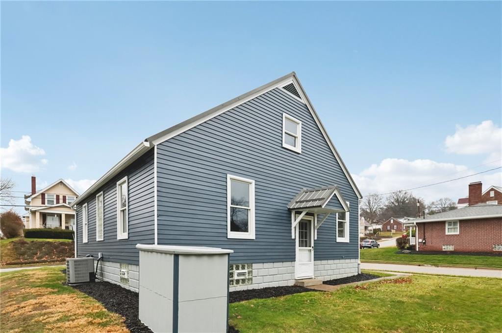 380 James Street Springdale, PA 15144 - Photo 30 of 34 a view of a house with a yard
