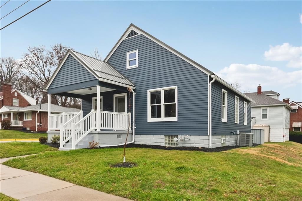 380 James Street Springdale, PA 15144 - Photo 3 of 34 a front view of a house with a yard