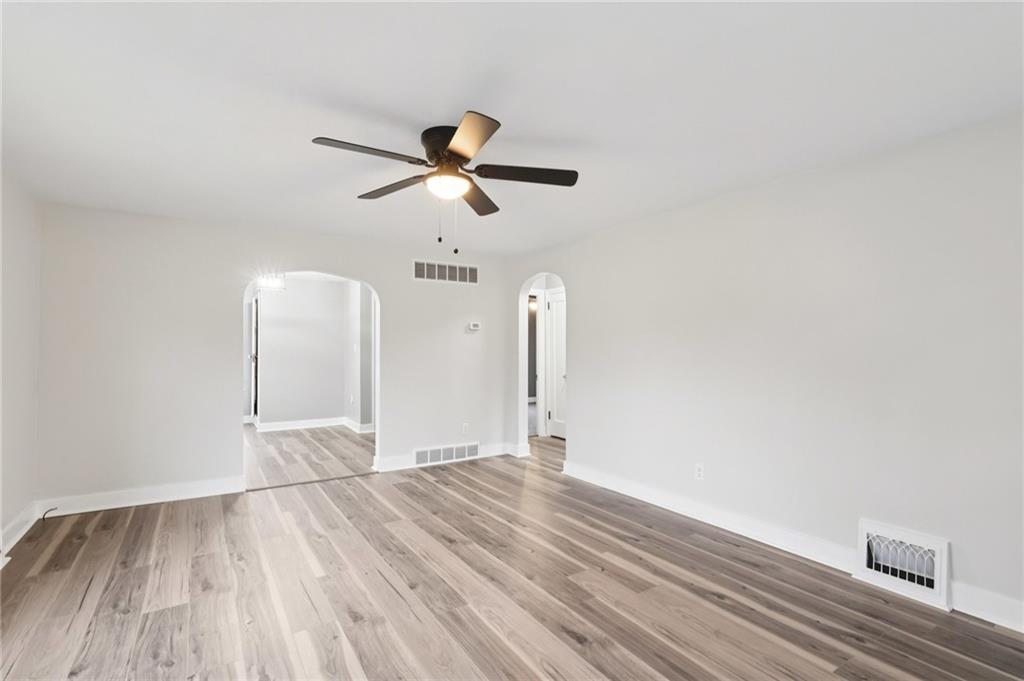 380 James Street Springdale, PA 15144 - Photo 10 of 34 a view of a room with wooden floor ceiling fan and window