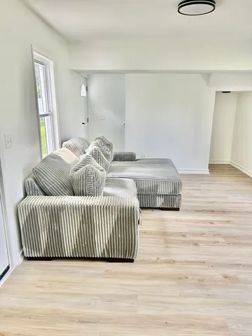 a bedroom with a bed and a rug