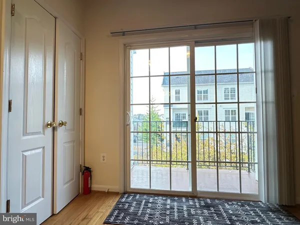 a view of hallway with wooden floor