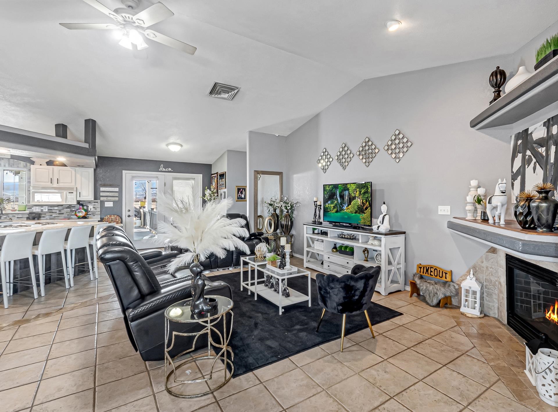 796 23 Road Grand Junction, CO 81505 - Photo 5 of 36 a living room with furniture a flat screen tv and kitchen view