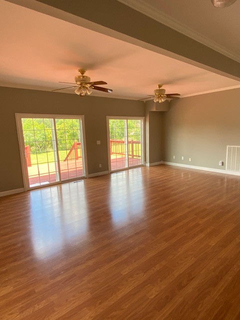 830 Blakemore Road Dickson, TN 37055 - Photo 14 of 33 a view of an empty room with wooden floor and a window