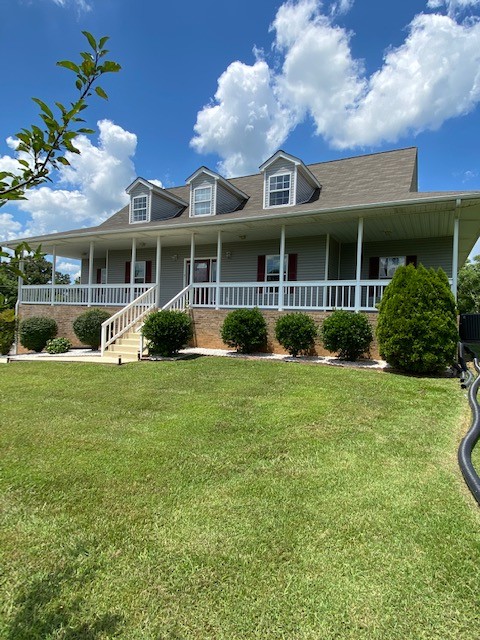 830 Blakemore Road Dickson, TN 37055 - Photo 3 of 33 a view of a house with a garden and plants