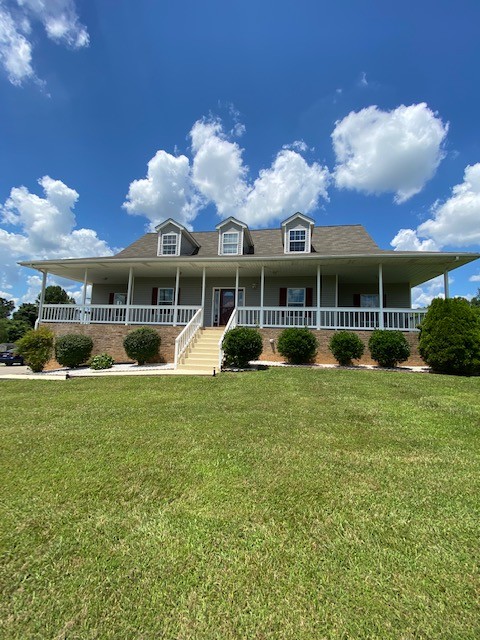 830 Blakemore Road Dickson, TN 37055 - Photo 5 of 33 a view of a house with a backyard