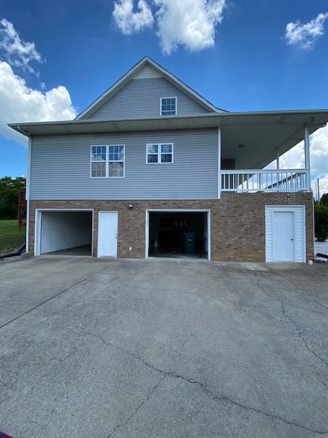 830 Blakemore Road Dickson, TN 37055 - Photo 6 of 33 a front view of a house with a yard and garage