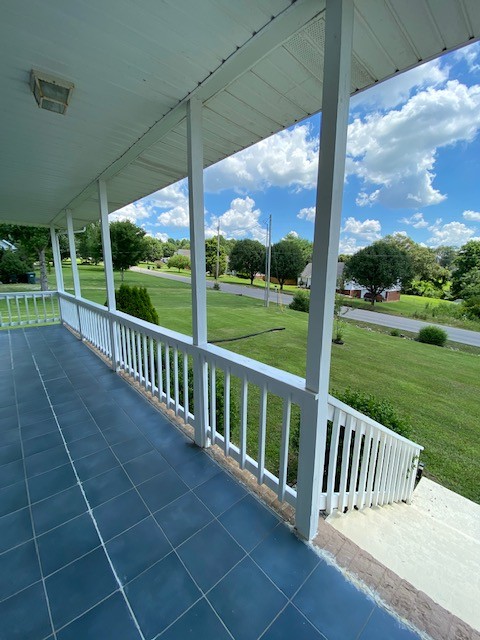 830 Blakemore Road Dickson, TN 37055 - Photo 7 of 33 a view of a deck with a big yard potted plants and floor to ceiling window
