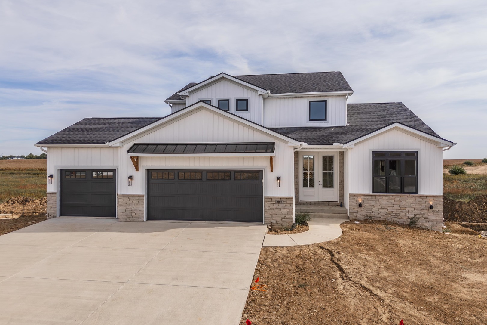 a front view of a house with a yard