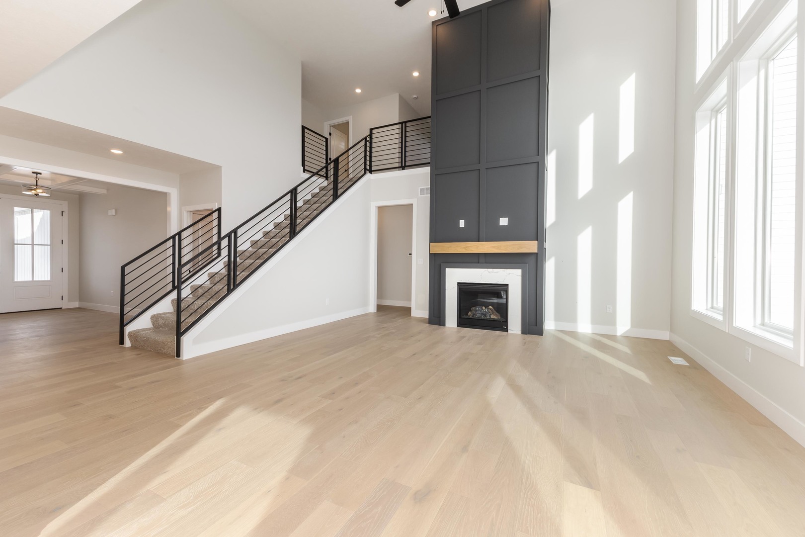 1004 Mount Carmel Road Bloomington, IL 61705 - Photo 15 of 44 a view of an empty room with wooden floor and a window