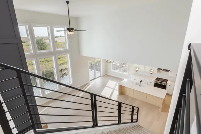 a view of a living room with furniture and window