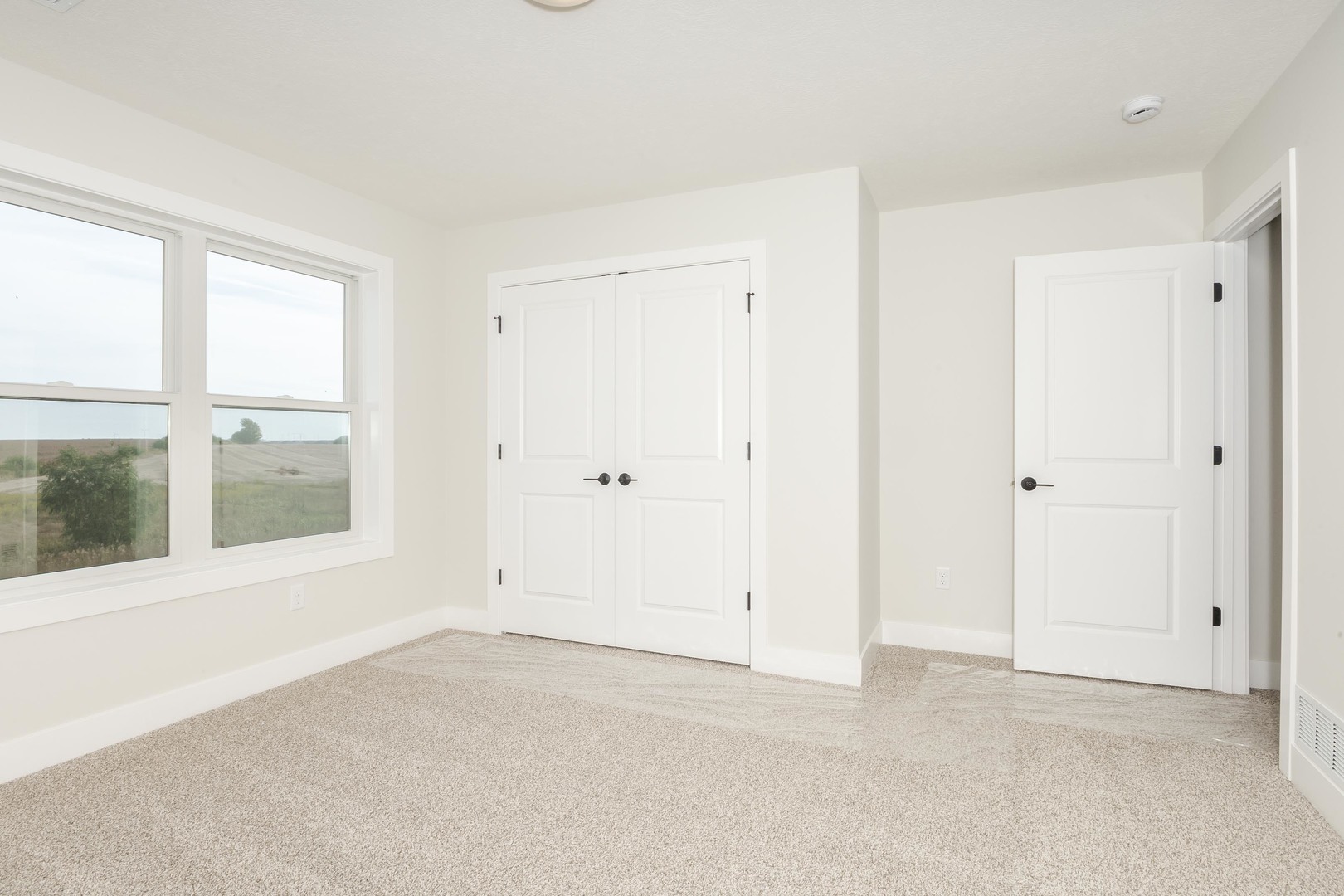 1004 Mount Carmel Road Bloomington, IL 61705 - Photo 30 of 44 an empty room with a window