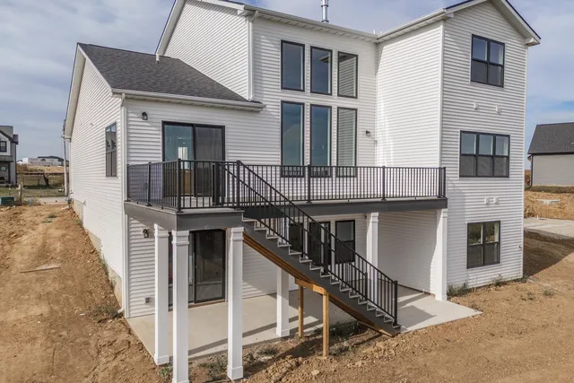 a front view of a house with many windows