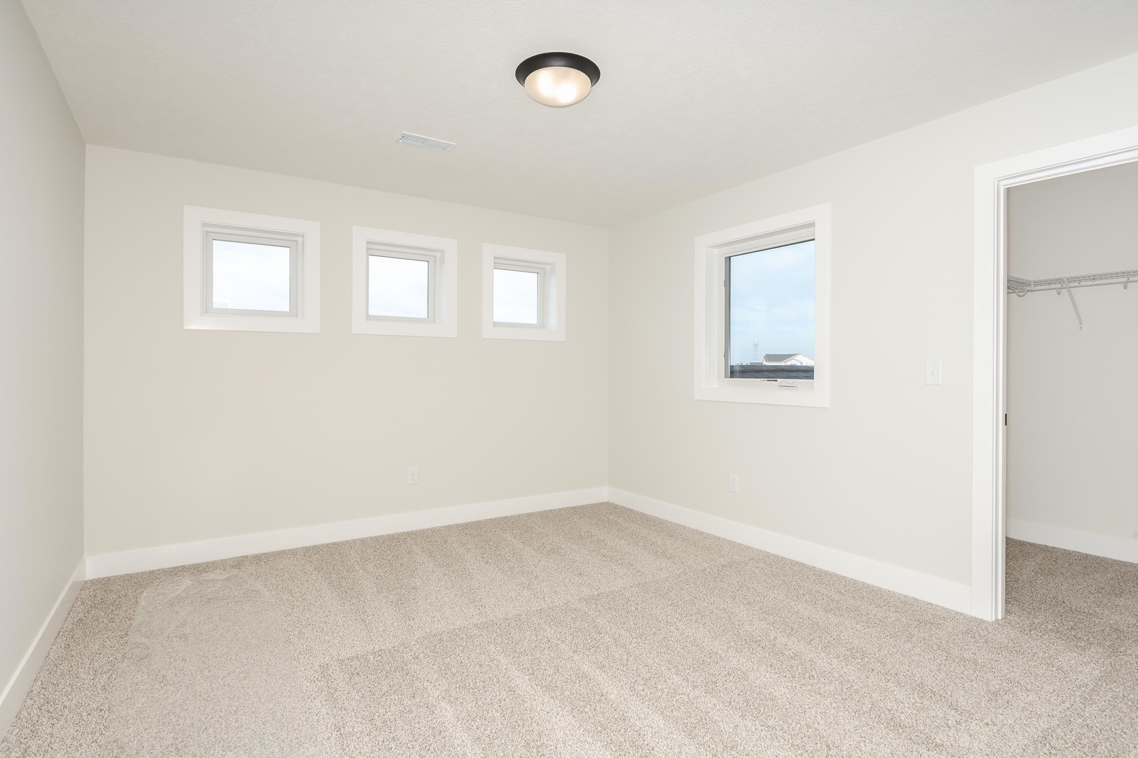 1004 Mount Carmel Road Bloomington, IL 61705 - Photo 32 of 44 an empty room with a empty space and a window