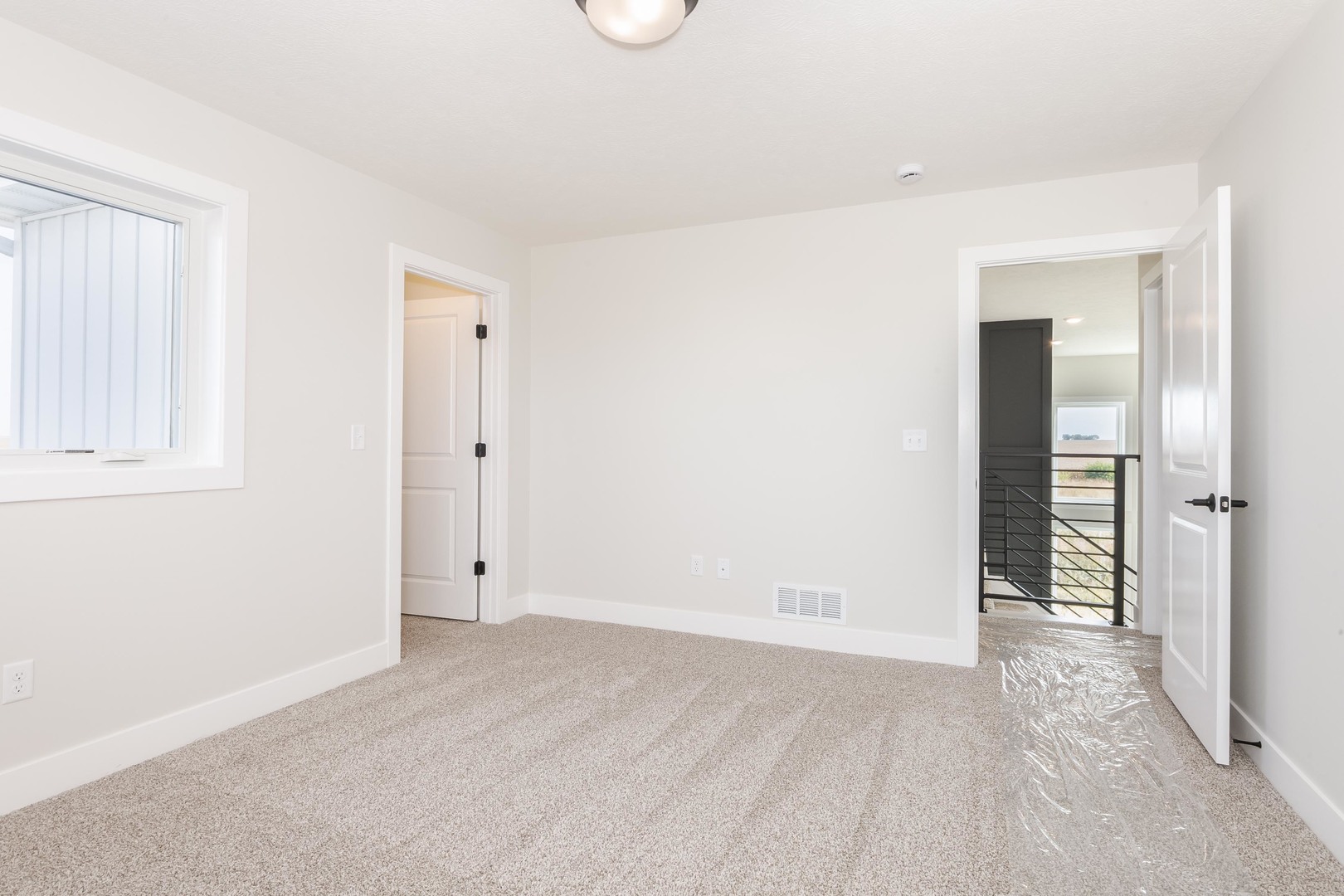 1004 Mount Carmel Road Bloomington, IL 61705 - Photo 33 of 44 an empty room with closet and mirror