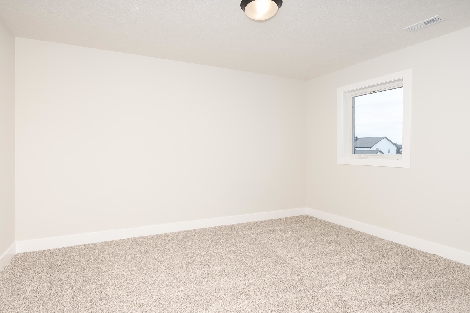 1004 Mount Carmel Road Bloomington, IL 61705 - Photo 34 of 44 an empty room with a window