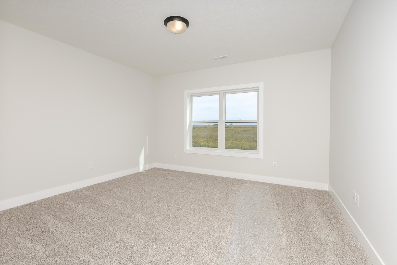 1004 Mount Carmel Road Bloomington, IL 61705 - Photo 40 of 44 an empty room with a window