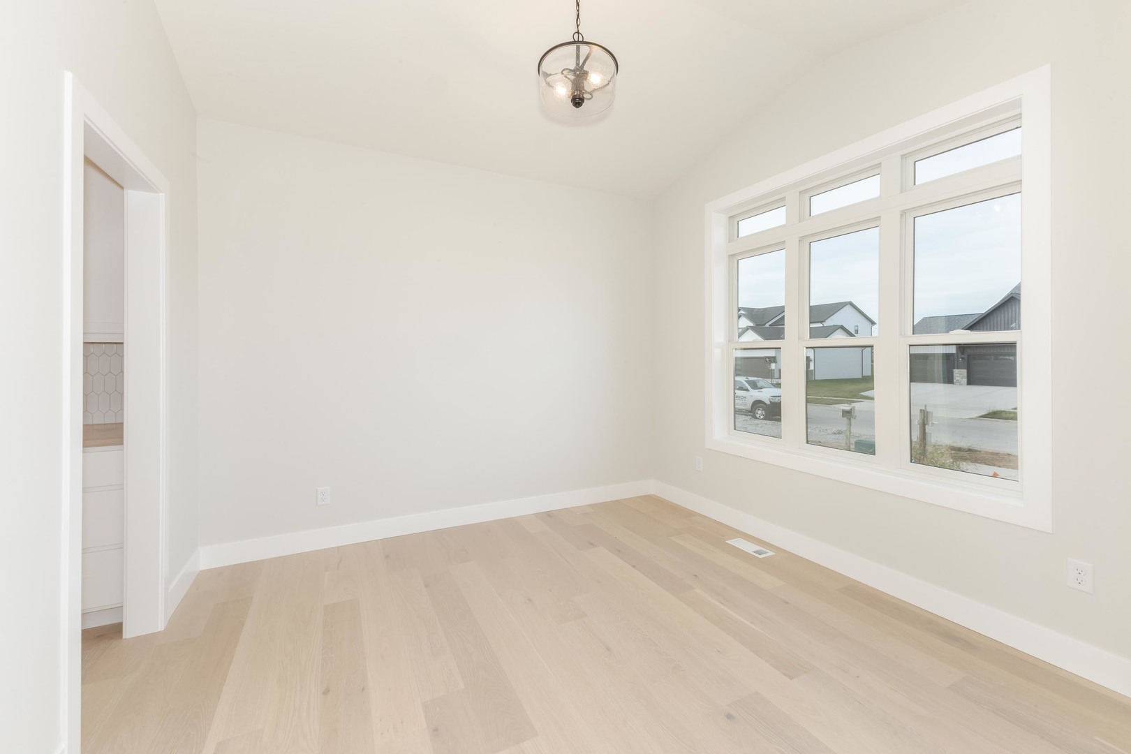 1004 Mount Carmel Road Bloomington, IL 61705 - Photo 4 of 44 a view of an empty room with a window