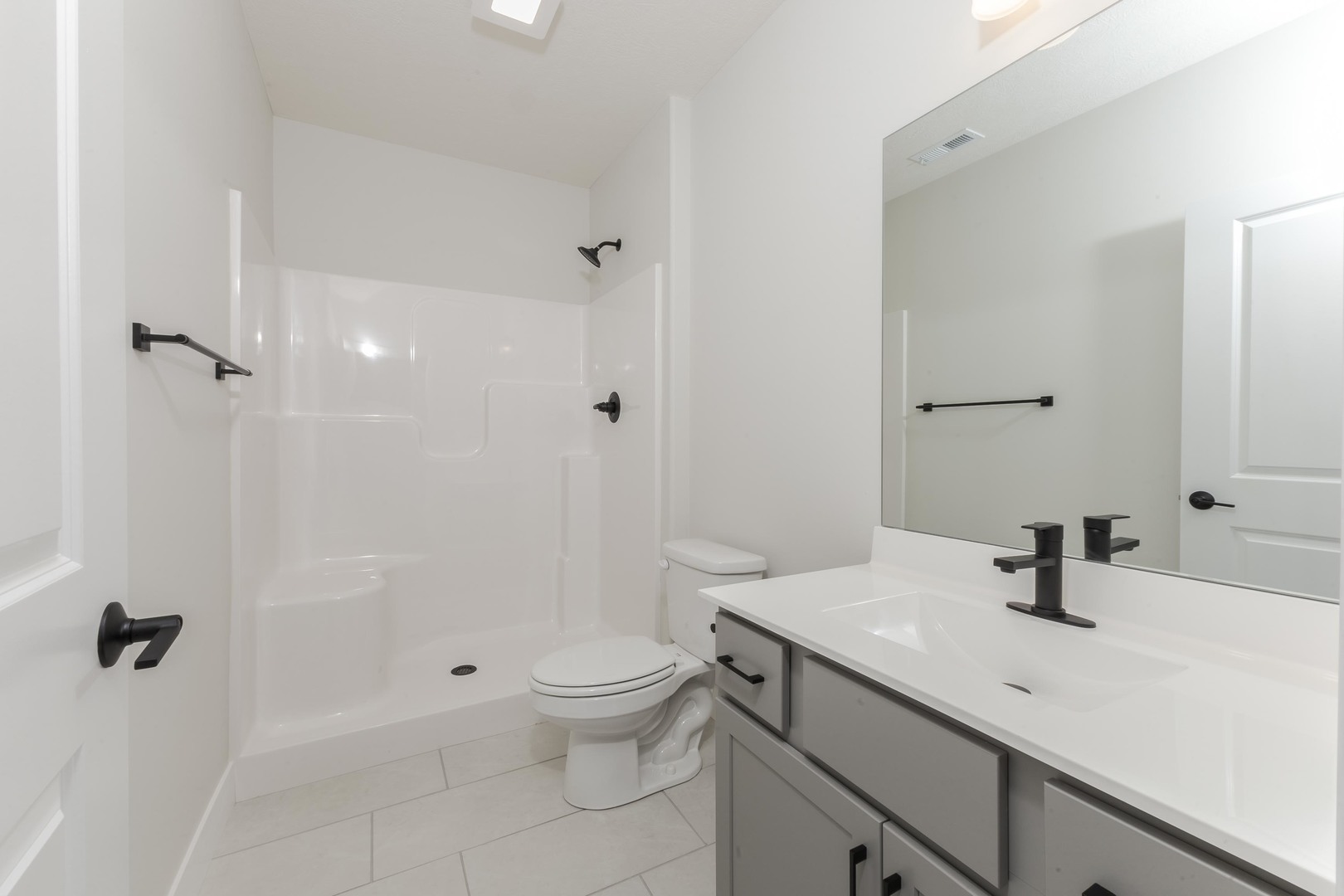 1004 Mount Carmel Road Bloomington, IL 61705 - Photo 42 of 44 a bathroom with a sink a toilet and shower