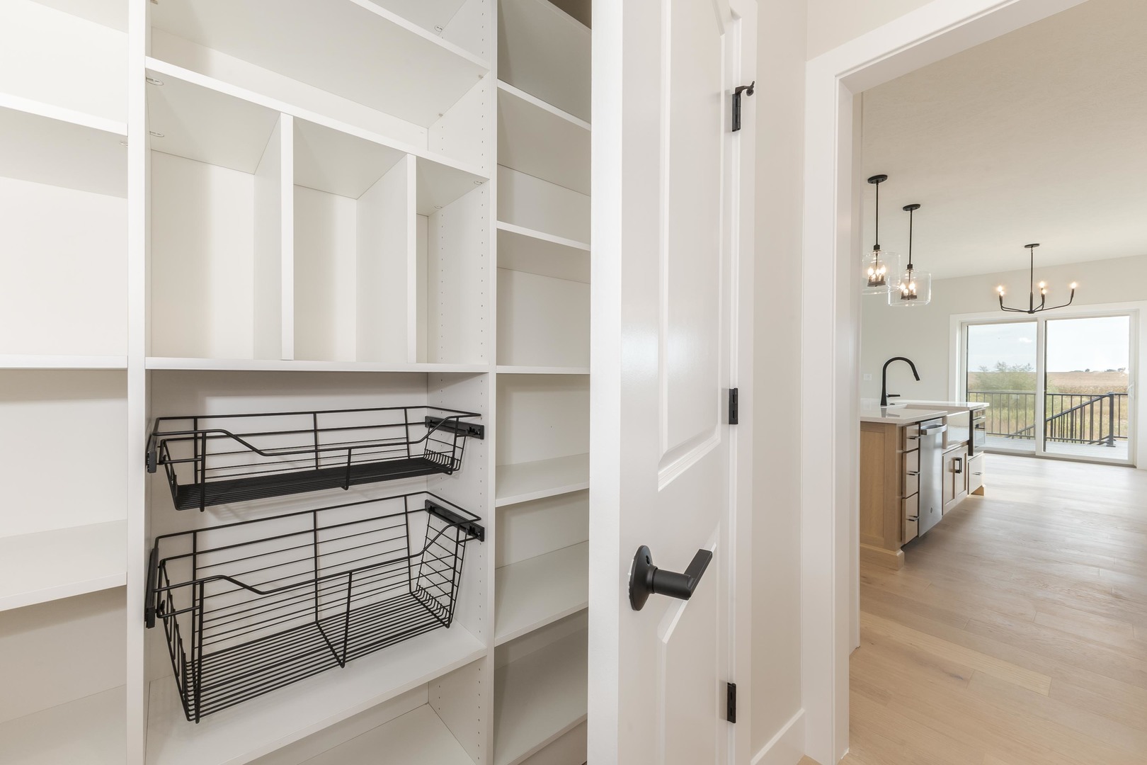 1004 Mount Carmel Road Bloomington, IL 61705 - Photo 8 of 44 a kitchen with a refrigerator and white cabinets