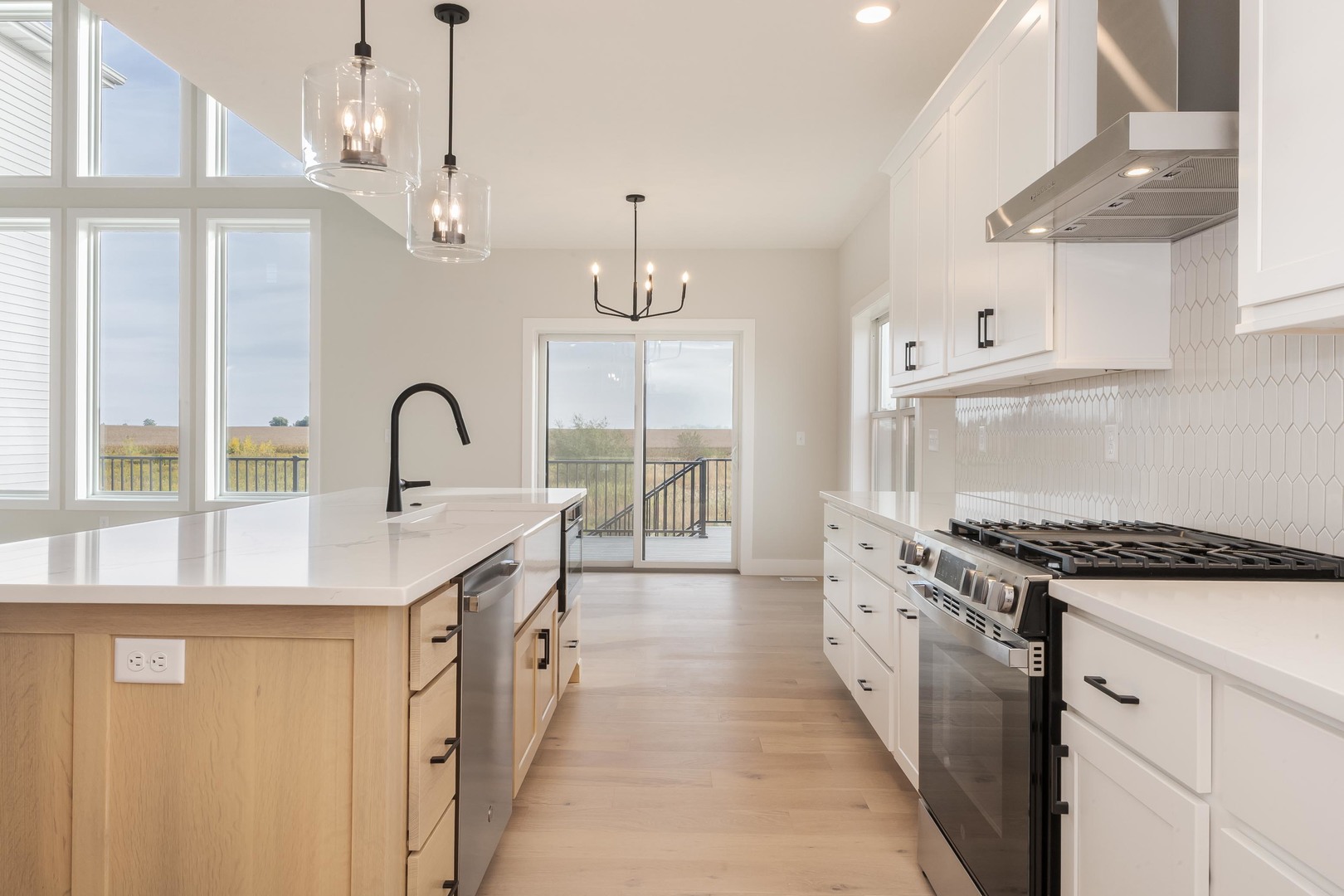 1004 Mount Carmel Road Bloomington, IL 61705 - Photo 9 of 44 a kitchen with stainless steel appliances a sink stove and cabinets