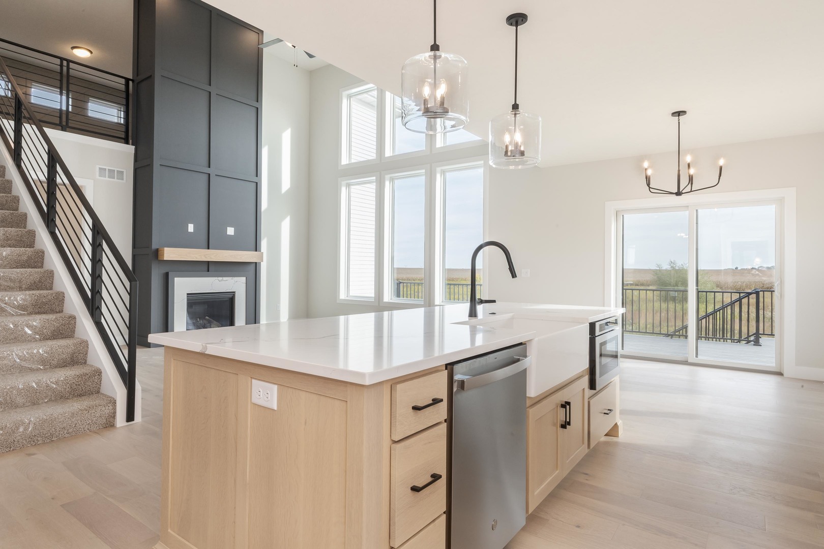 1004 Mount Carmel Road Bloomington, IL 61705 - Photo 10 of 44 a kitchen with a sink and a chandelier