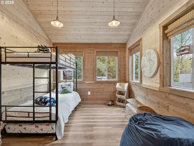 a living room with furniture a window and a chandelier