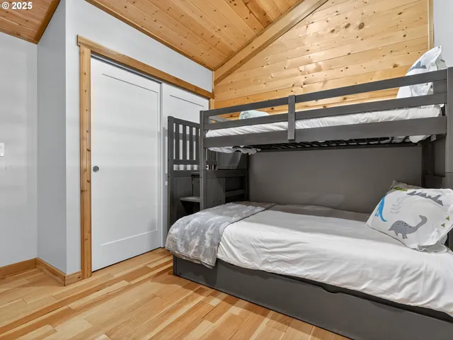 a bedroom with a bed and a cabinet