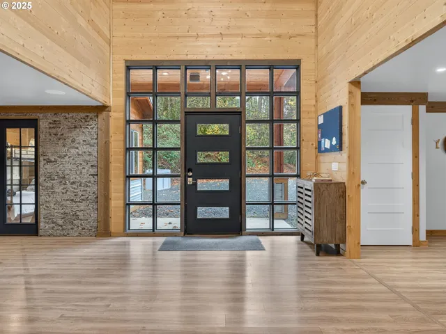 a view of an entryway with wooden floor
