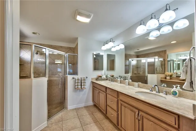 a bathroom with a double vanity sink and a mirror
