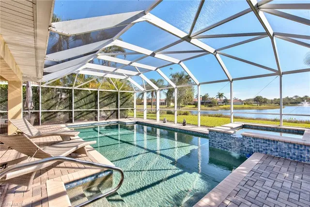 a view of a swimming pool with a lounge chairs
