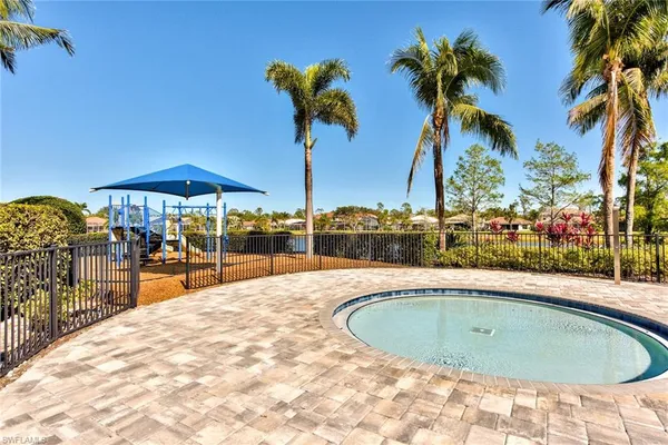a swimming pool with outdoor seating and yard