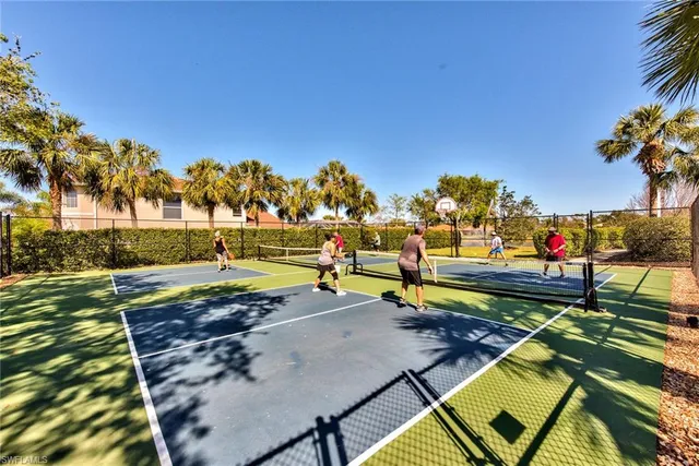 a view of a swimming pool with an outdoor seating