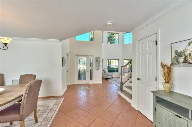 a view of a hallway with furniture and windows