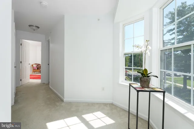 a view of livingroom with furniture and mirror