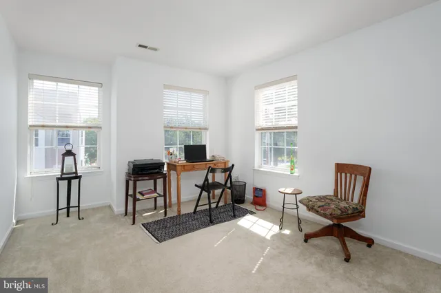 a workspace with furniture and a window