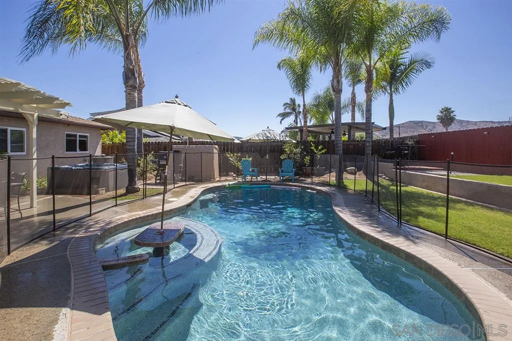 9228 Bellagio Road Santee, CA 92071 - Photo 1 of 25 a backyard of a house with seating space