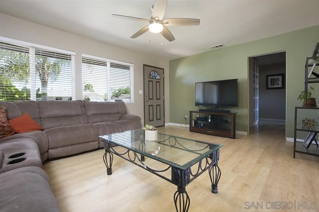 9228 Bellagio Road Santee, CA 92071 - Photo 5 of 25 a living room with furniture and a flat screen tv