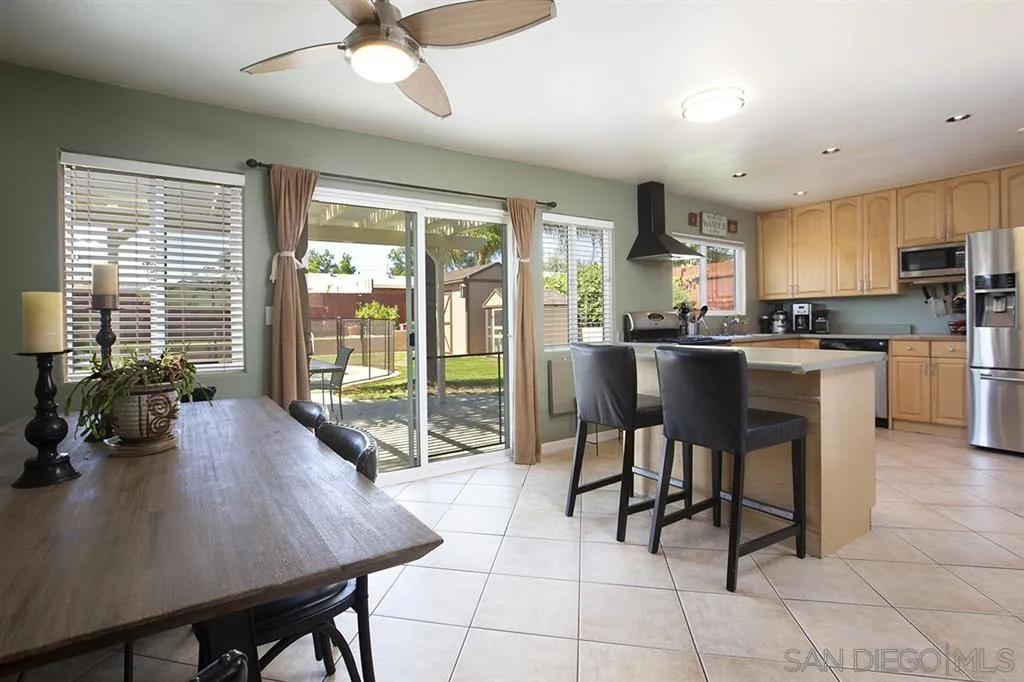 9228 Bellagio Road Santee, CA 92071 - Photo 7 of 25 a view of a dining room with furniture
