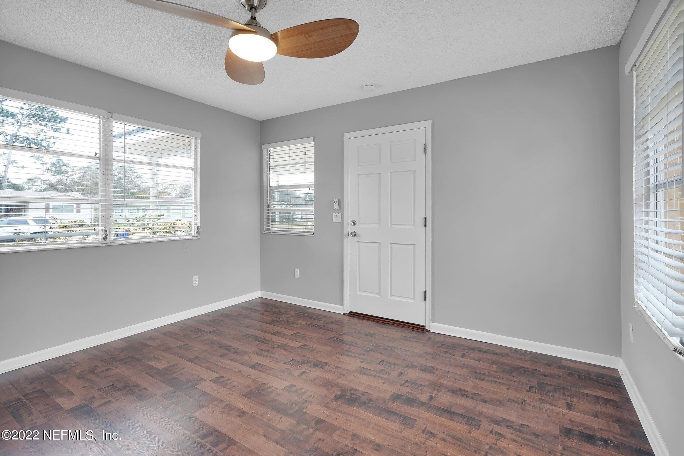 208 Baracoa Court St. Augustine, FL 32086 - Photo 12 of 32 wooden floor in an empty room with a window