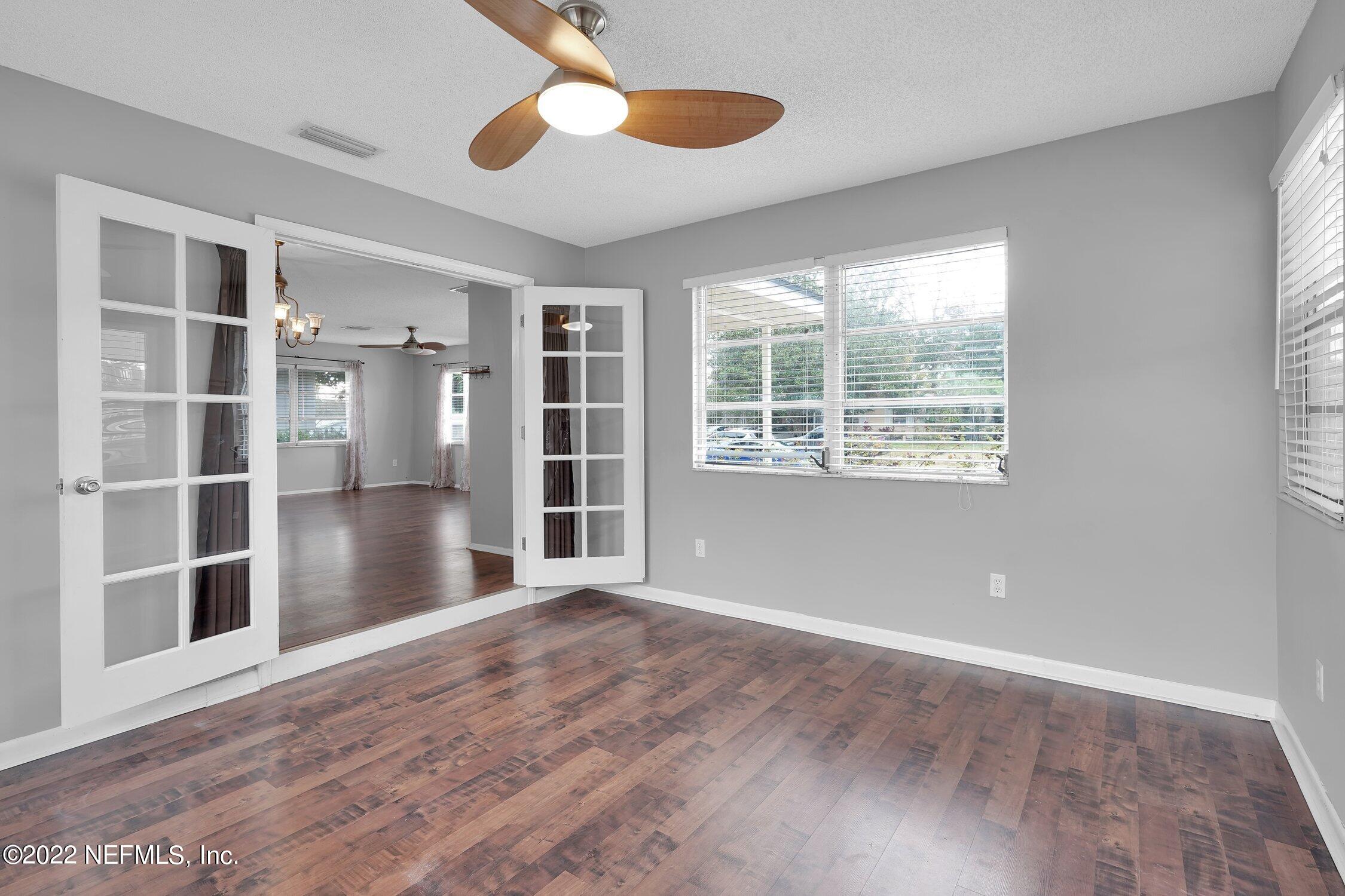208 Baracoa Court St. Augustine, FL 32086 - Photo 14 of 32 an empty room with cabinet and windows