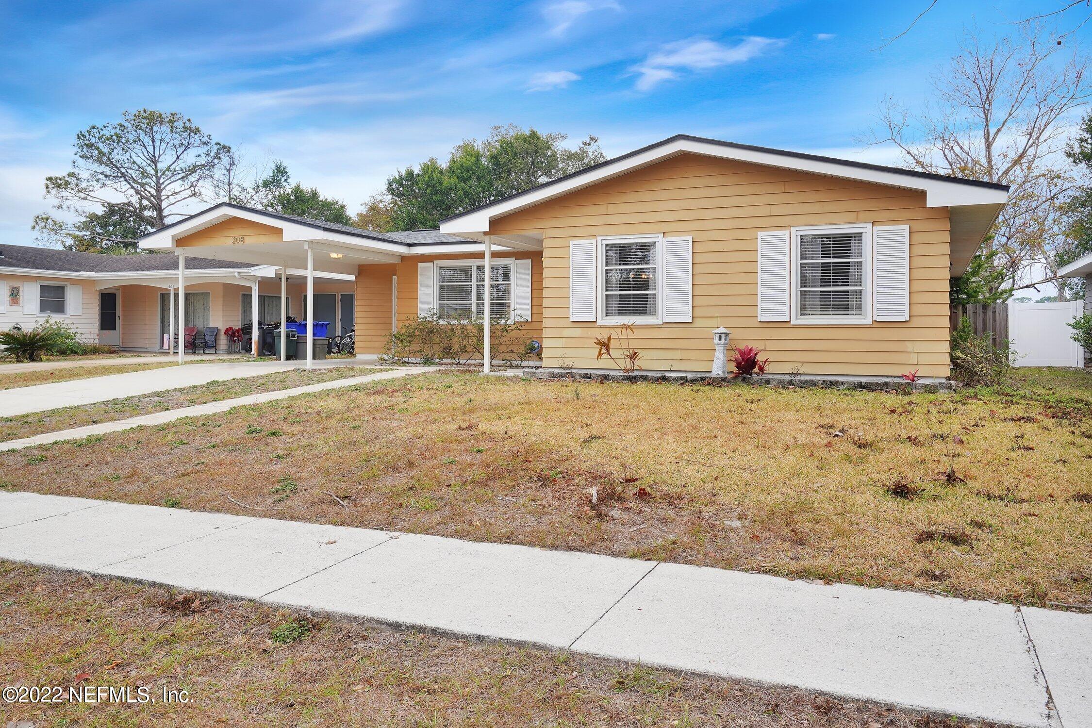208 Baracoa Court St. Augustine, FL 32086 - Photo 2 of 32 a front view of a house with a yard