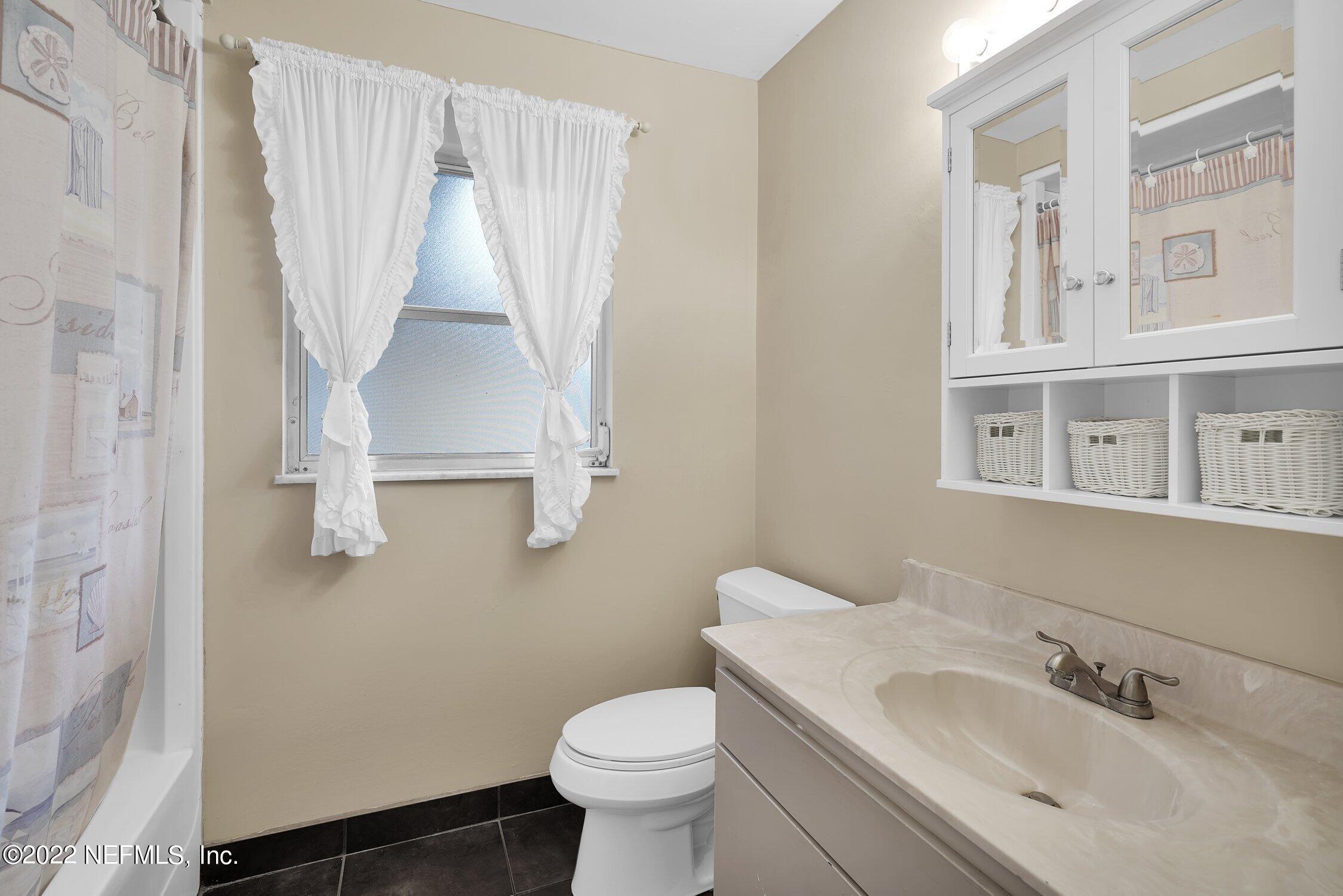 208 Baracoa Court St. Augustine, FL 32086 - Photo 21 of 32 a bathroom with a sink toilet and window
