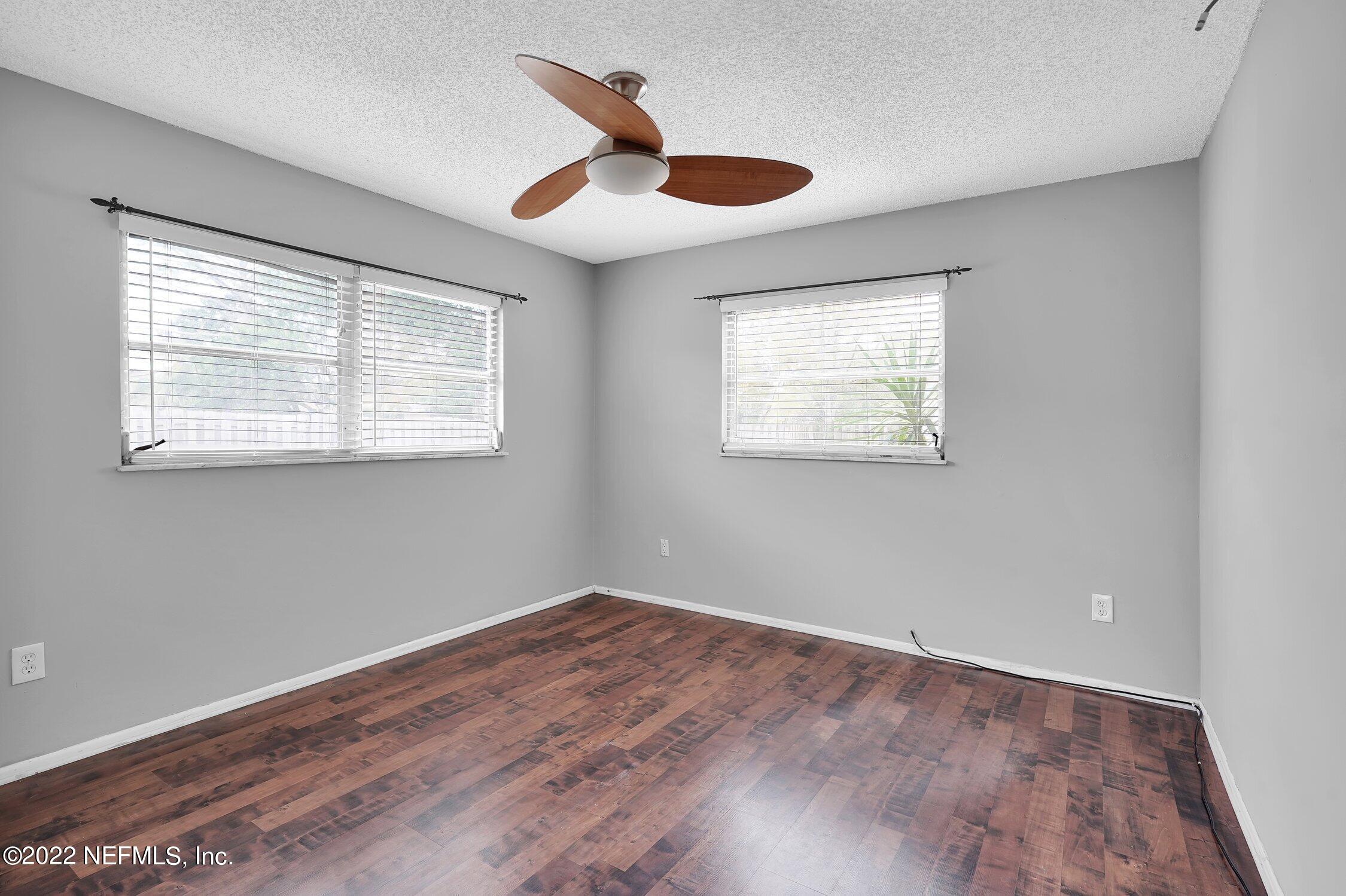 208 Baracoa Court St. Augustine, FL 32086 - Photo 22 of 32 a view of empty room with wooden floor and fan
