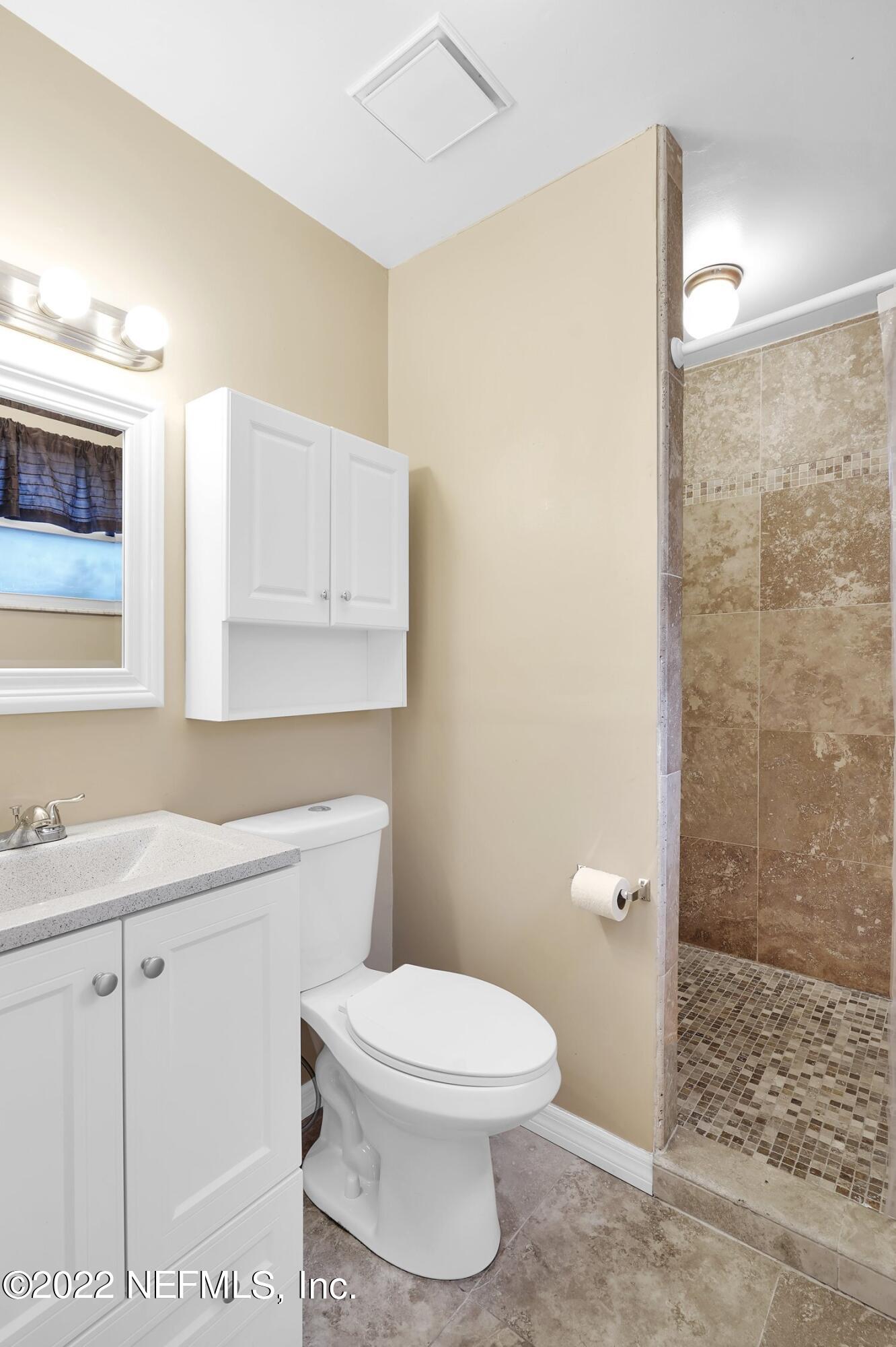 208 Baracoa Court St. Augustine, FL 32086 - Photo 26 of 32 a white toilet sitting next to a bathroom sink